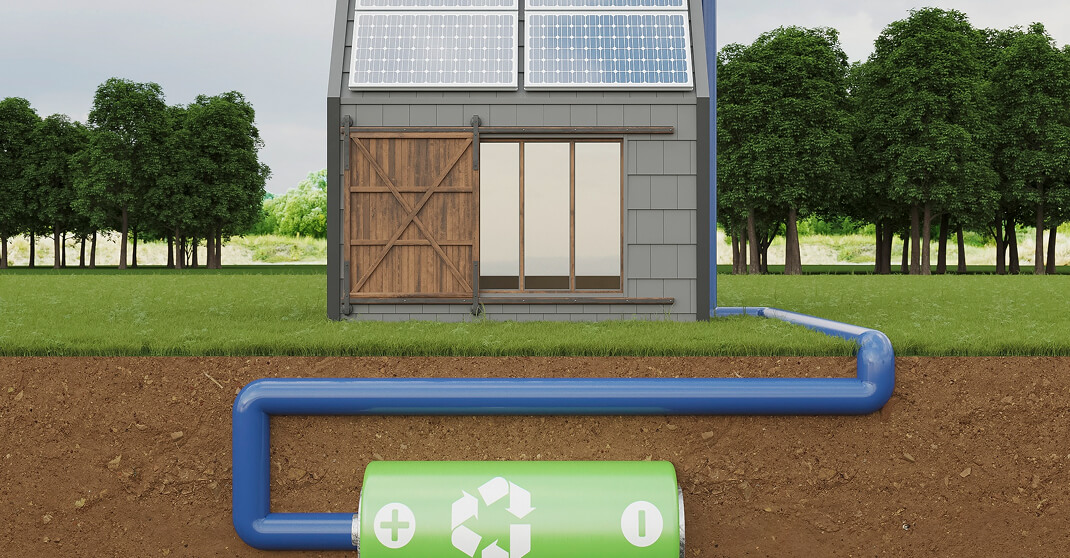 3D-Illustration zeigt Haus mit Solaranlage und Batteriespeicher unter der Erde